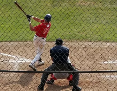 view of athletes playing baseball in the field